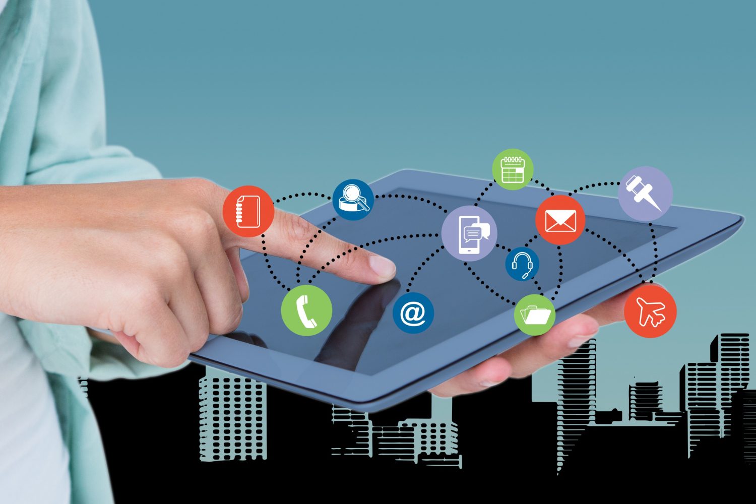 Businessman with icons floating around his finger Businessman with icons floating around his finger<br />
